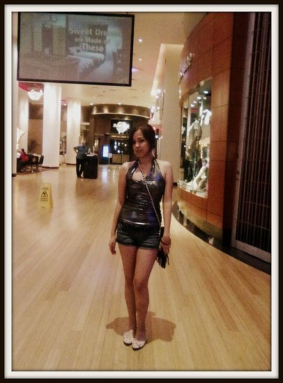 metallic silver halter top, shorts, and Balmain side bag